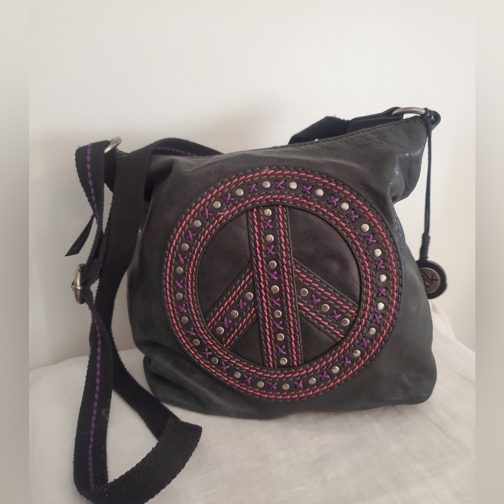 The Sak distressed black leather with peace sign.